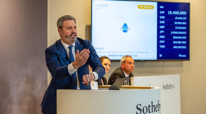 Quig Bruning, Head of Sotheby’s Jewels Americas, fields the final bid on the Bulgari Laguna Blu, the top lot of Sotheby's Magnificent Jewels and Noble Jewels Sale on 16 May 2023