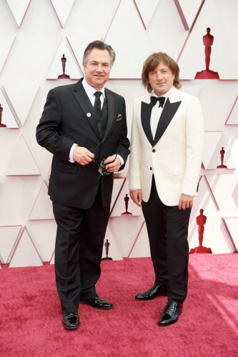 Oscar nominee Daniel Pemberton (R) and guest arrive on the red carpet of The 93rd Oscars at Union Station in Los Angeles, CA on Sunday, April 25, 2021.