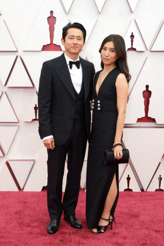 Oscar nominee Steven Yeun and Joana Pak arrive on the red carpet of The 93rd Oscars at Union Station in Los Angeles, CA on Sunday, April 25, 2021.